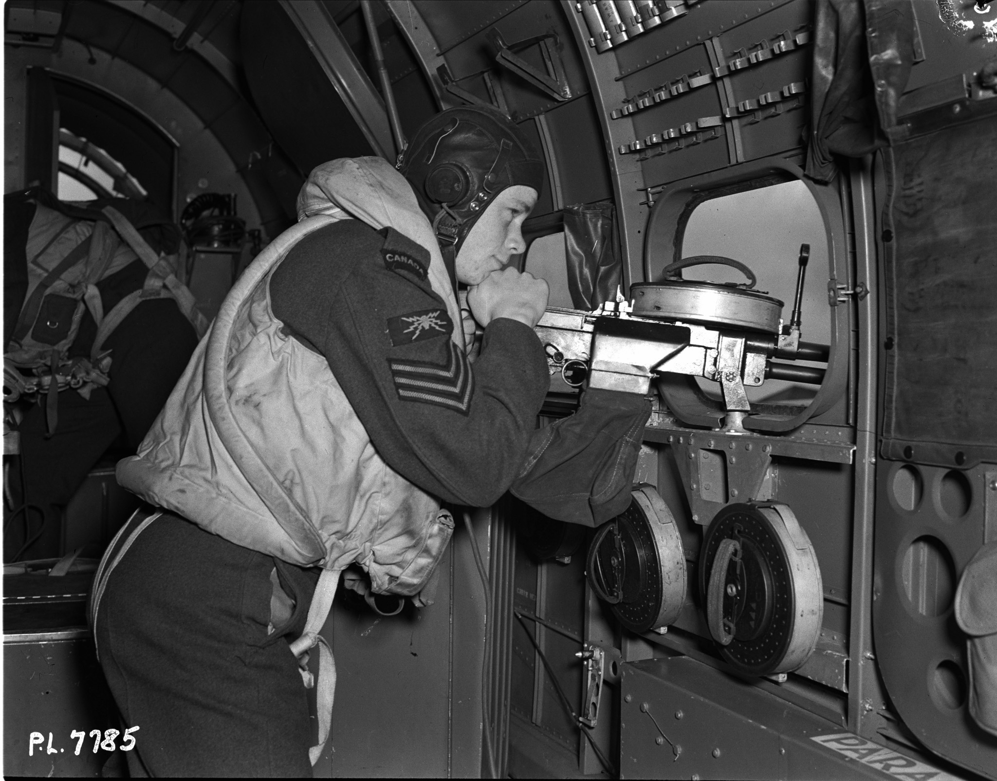Sergeant R. S. Sandelin, of Cornwall, Ontario, is an air gunner with the RCAF’s “Demon Squadron”, part of Coastal Command. He joined the Air Force as soon as he left school. PHOTO: DND Archives, PL-7785